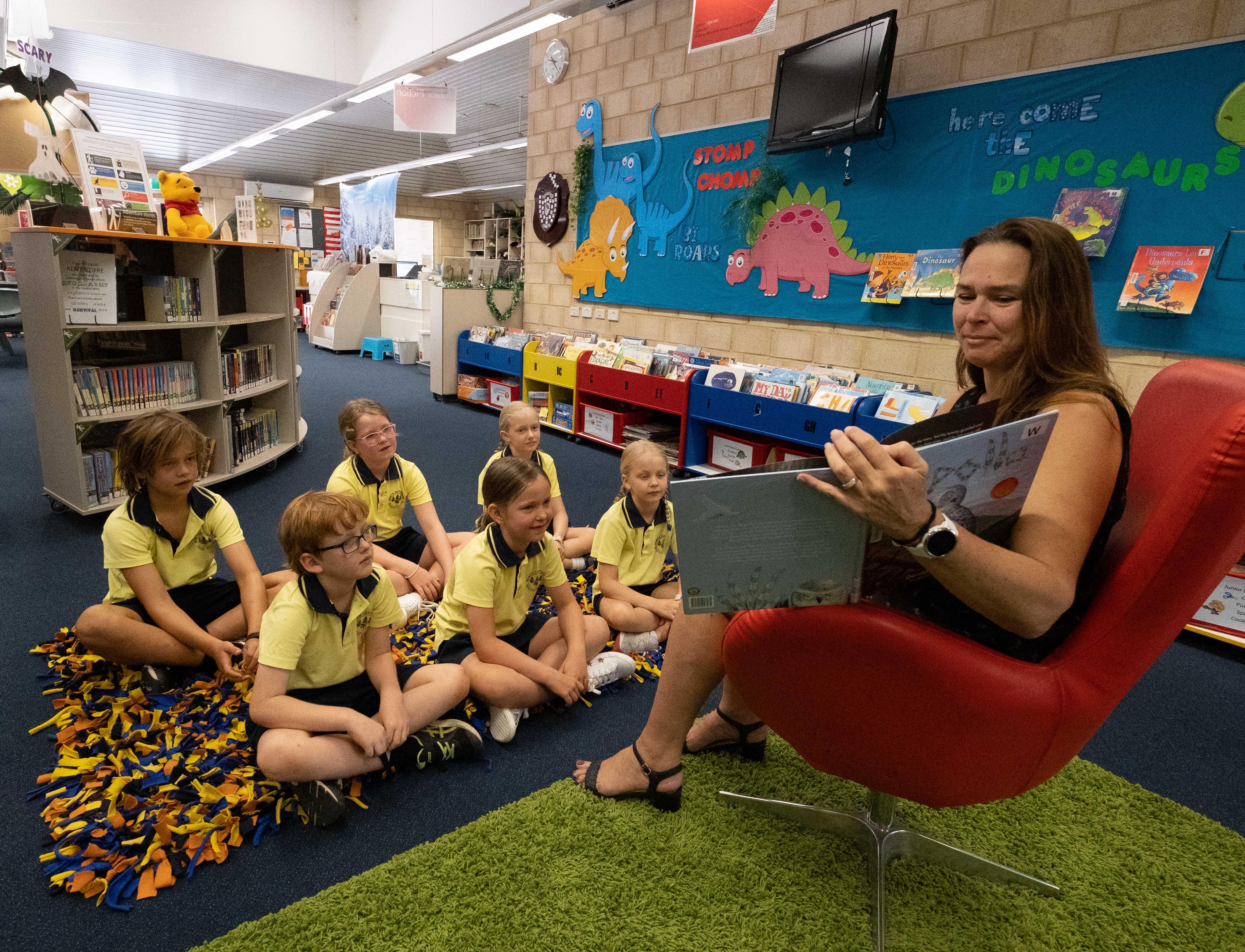 Librarian reading to students