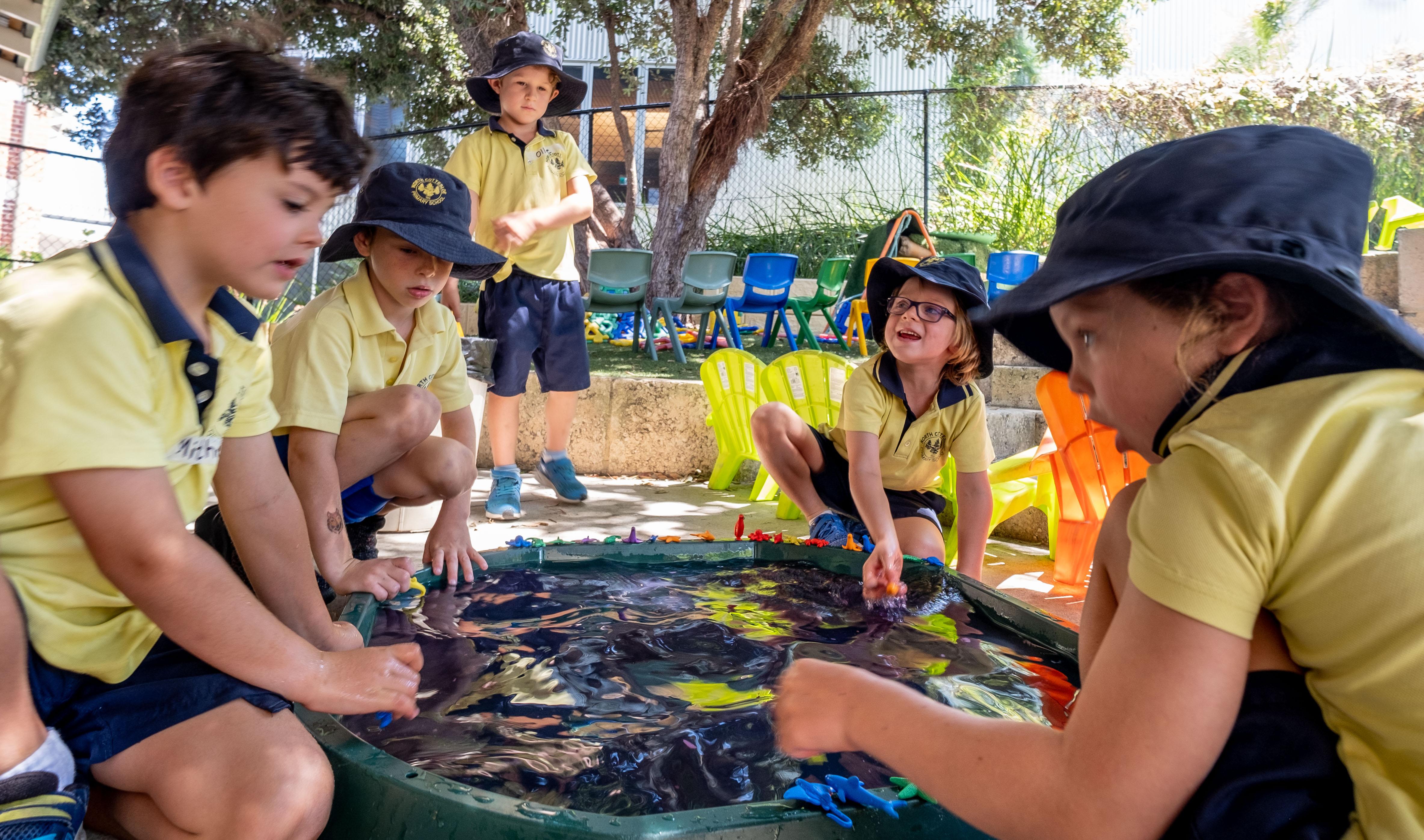 Students doing water play