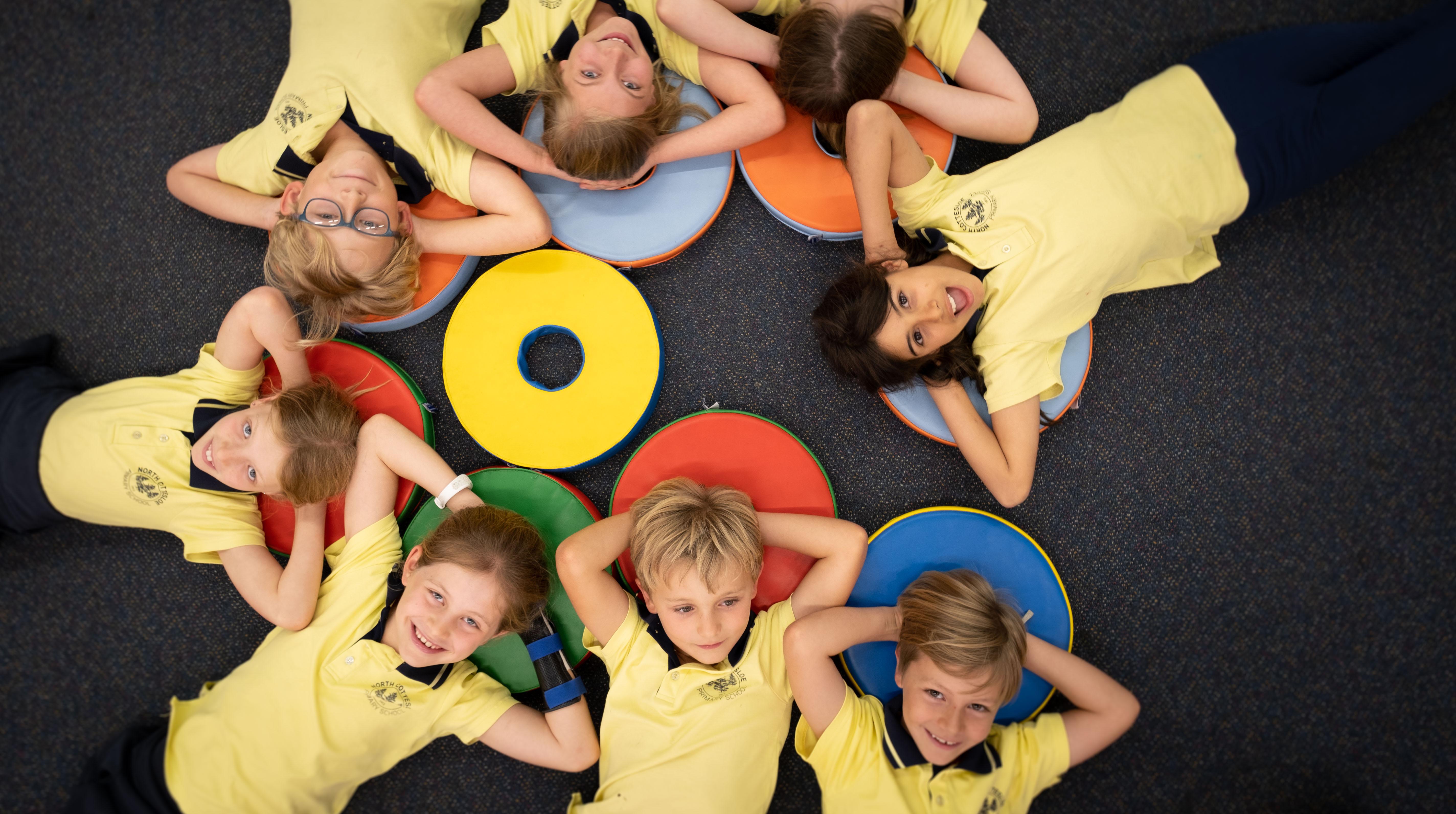 Students relaxing in a circle